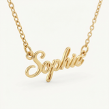 Close-up of a gold cursive name plate